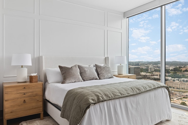 bedroom featuring floor to ceiling windows