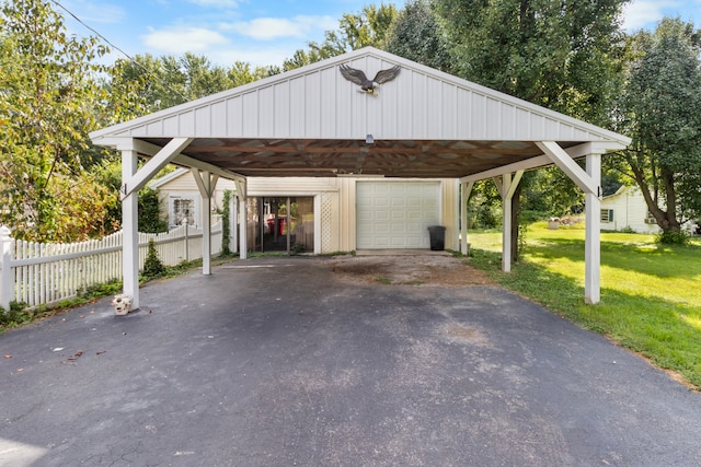 exterior space with a garage, a front yard, and a carport