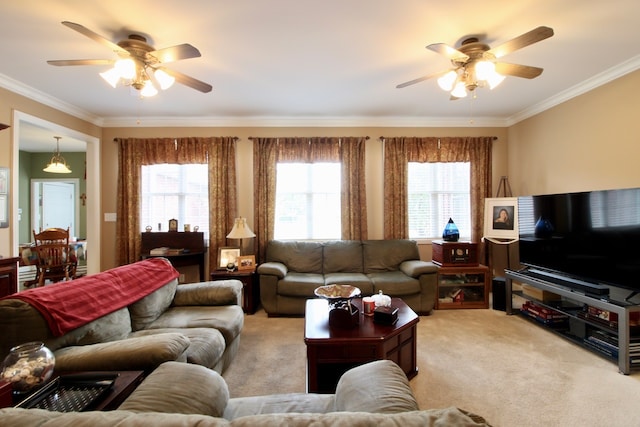 living room featuring ceiling fan, carpet, and a healthy amount of sunlight