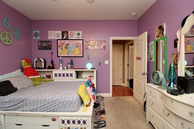 bedroom featuring light colored carpet