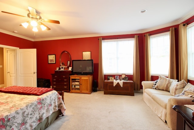 bedroom featuring ceiling fan, carpet floors, and ornamental molding