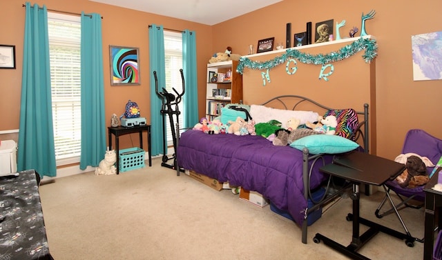 bedroom featuring multiple windows and carpet floors