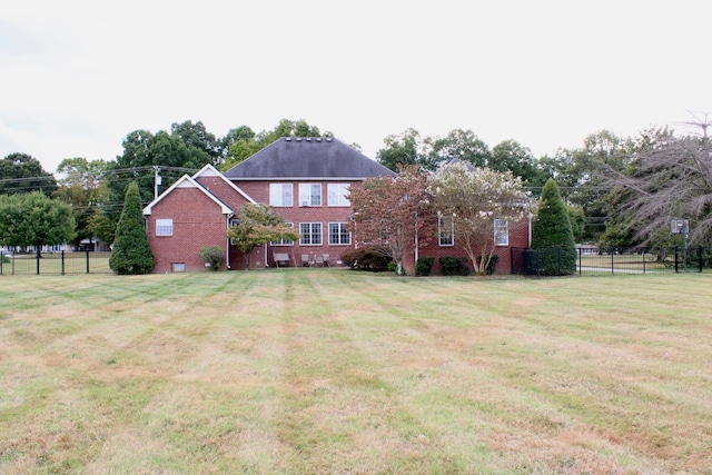 back of house with a yard