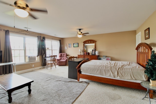 bedroom featuring ceiling fan and carpet