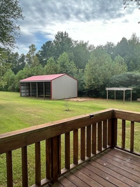 deck with an outbuilding and a yard