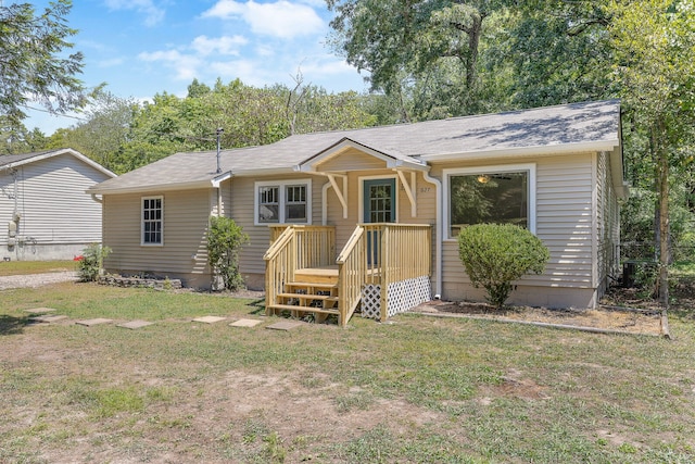 ranch-style house featuring a front lawn