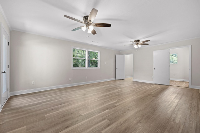 interior space with light wood-type flooring, crown molding, and ceiling fan