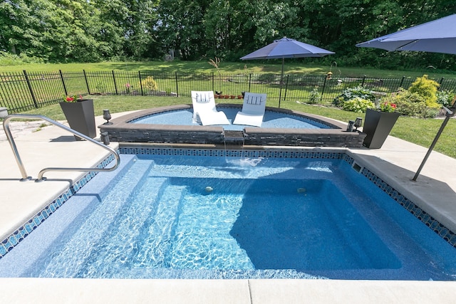 view of pool with a lawn and a patio