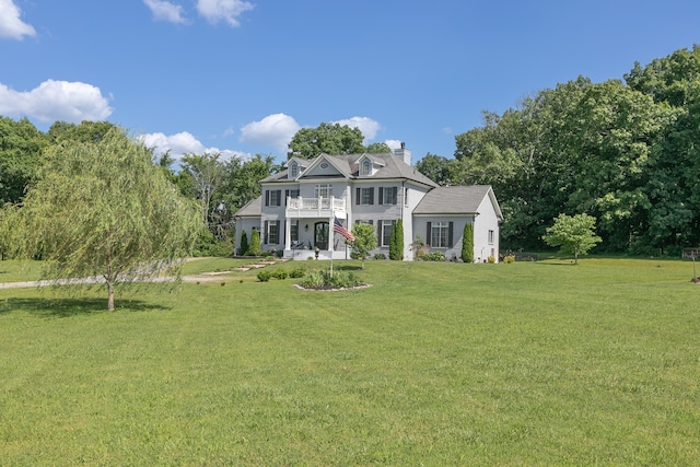 back of house featuring a yard