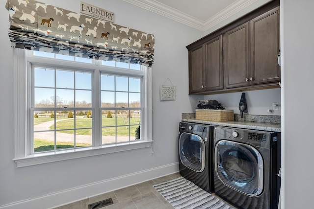 washroom featuring independent washer and dryer, light tile patterned flooring, cabinets, and ornamental molding