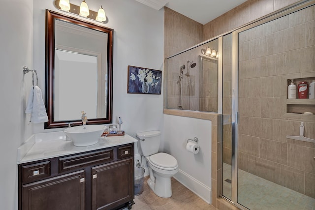 bathroom featuring vanity, walk in shower, and toilet