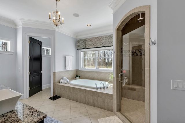 bathroom featuring a healthy amount of sunlight, separate shower and tub, ornamental molding, and tile patterned flooring