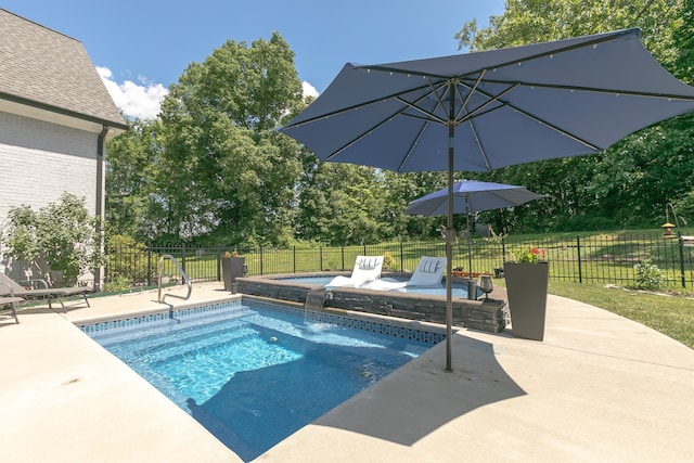 view of swimming pool featuring a patio area and a yard