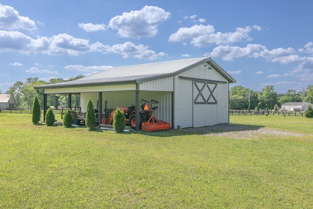 view of outbuilding featuring a lawn