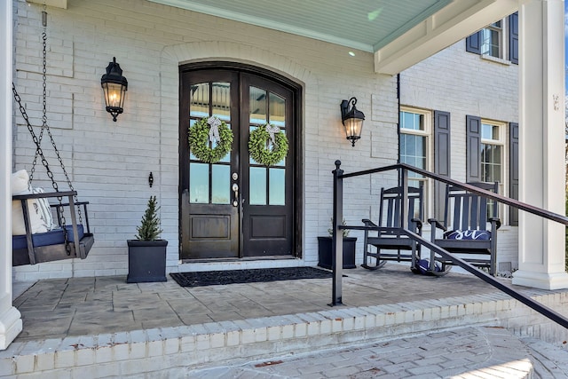 entrance to property with french doors and covered porch