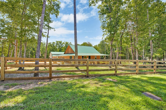 view of yard with a rural view