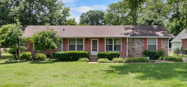 ranch-style home featuring a front yard