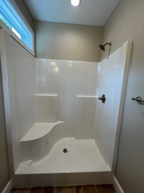 bathroom featuring tile patterned floors and a shower