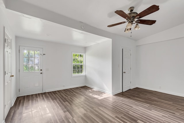 empty room featuring ceiling fan, wood-type flooring, and vaulted ceiling