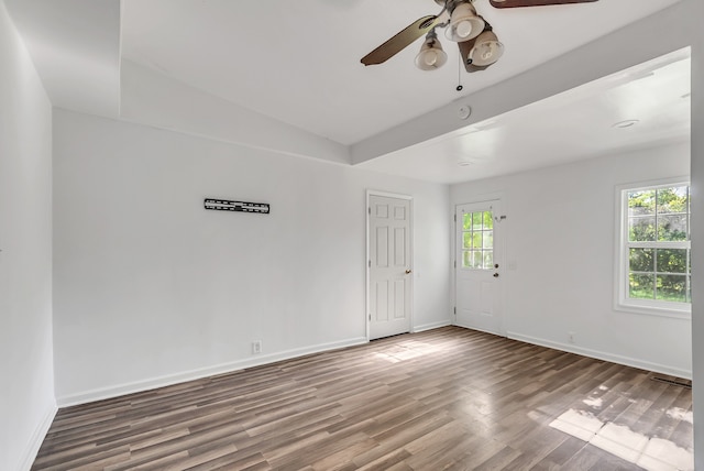 empty room featuring ceiling fan, lofted ceiling, and wood-type flooring