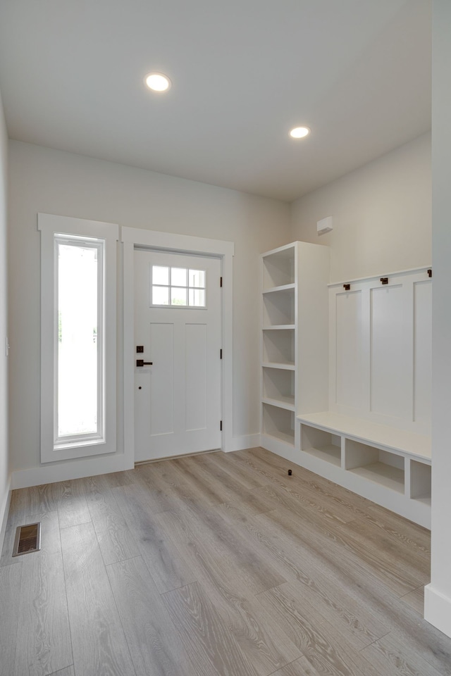 mudroom with light hardwood / wood-style flooring