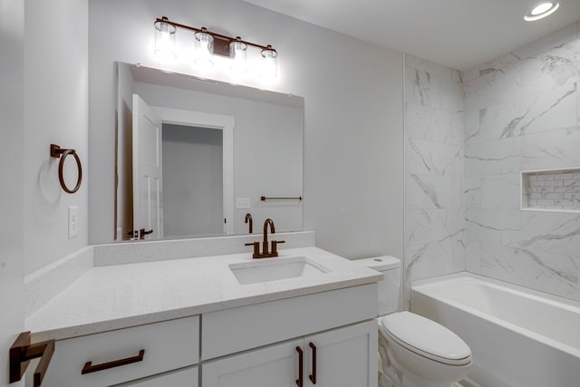 full bathroom with vanity, toilet, and tiled shower / bath