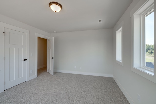 unfurnished bedroom with carpet flooring