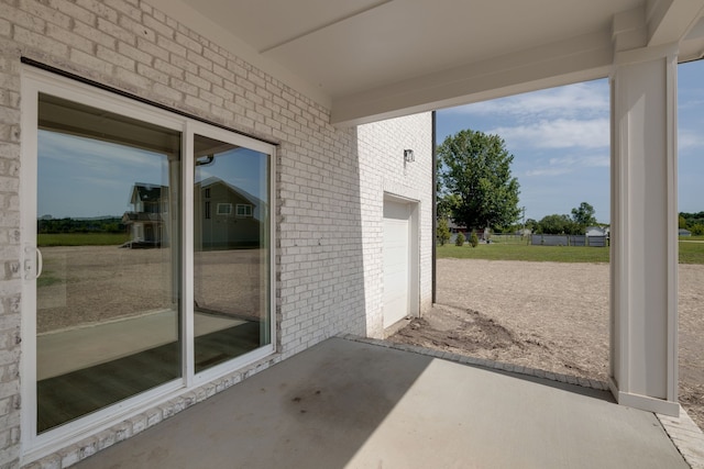 view of patio featuring a garage