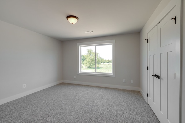 unfurnished bedroom featuring light colored carpet