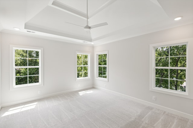 spare room featuring ceiling fan, plenty of natural light, and carpet floors