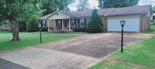 single story home featuring driveway, a porch, a front lawn, and brick siding