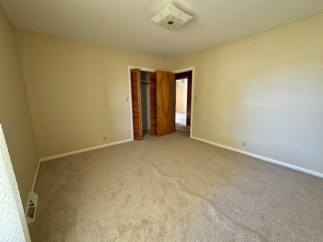 1716 Keller Ave, Pulaski, TN 38478 - unfurnished bedroom featuring baseboards, visible vents, a closet, and carpet