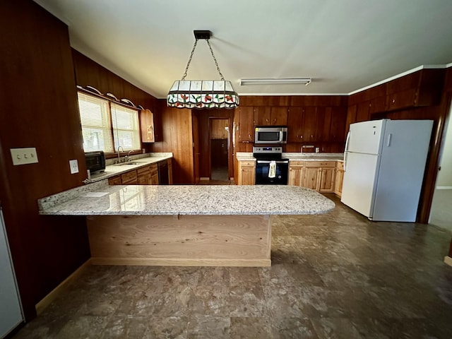 1716 Keller Ave, Pulaski, TN 38478 - kitchen with light stone countertops, a sink, stainless steel appliances, wooden walls, and a peninsula