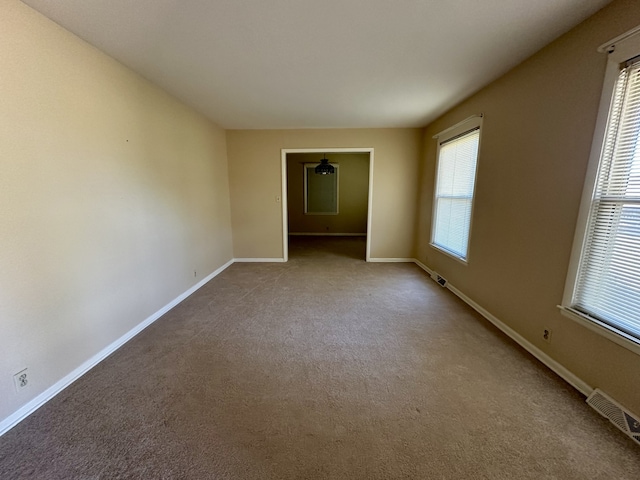 spare room with carpet floors