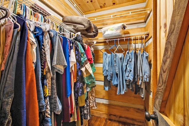 walk in closet featuring dark wood-type flooring