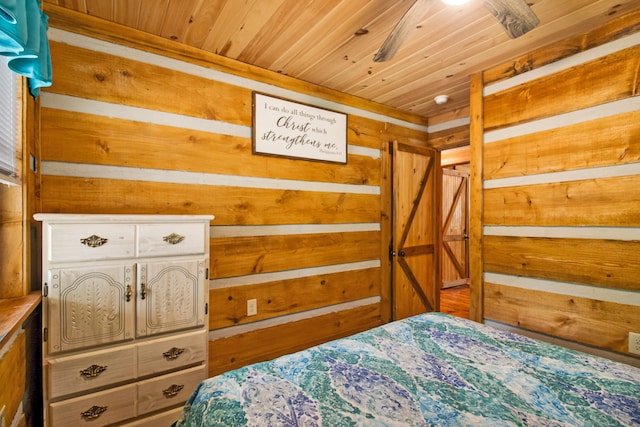 bedroom with wood walls and wood ceiling