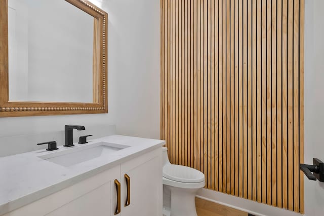 bathroom with toilet and vanity