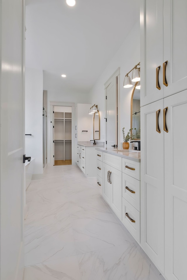 bathroom featuring tile patterned floors and vanity