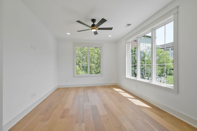 spare room featuring ceiling fan and light wood-type flooring