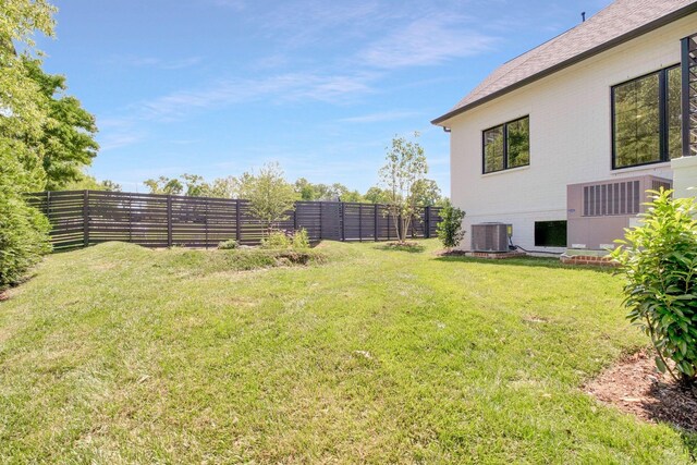 view of yard with central AC