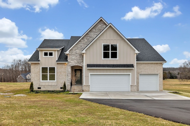 view of front of home featuring a garage and a front yard