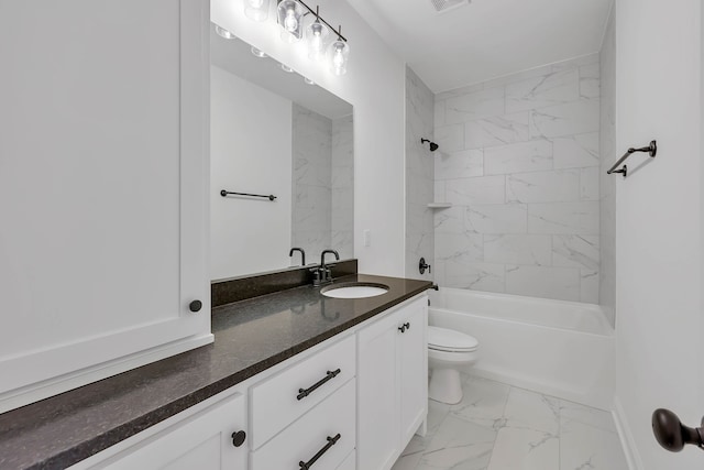 full bathroom with tiled shower / bath combo, toilet, and vanity