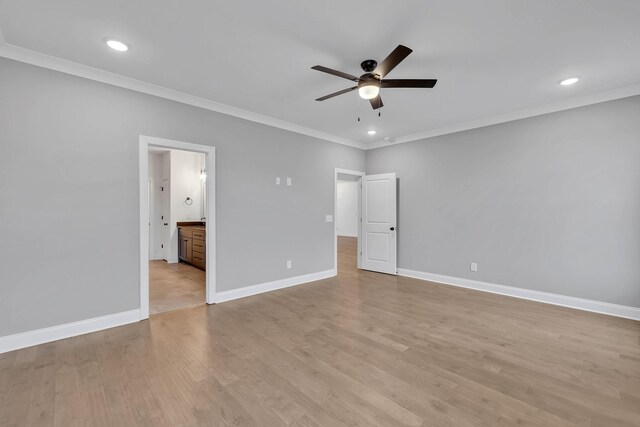 unfurnished bedroom featuring ensuite bathroom, ceiling fan, and ornamental molding