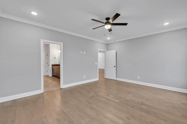 unfurnished bedroom with baseboards, recessed lighting, ornamental molding, light wood-type flooring, and connected bathroom