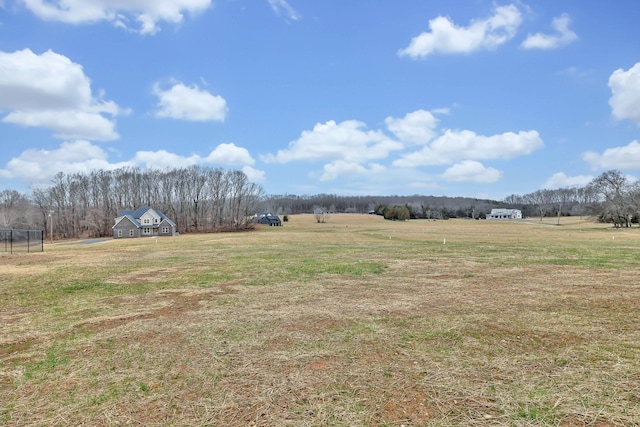 view of yard with a rural view