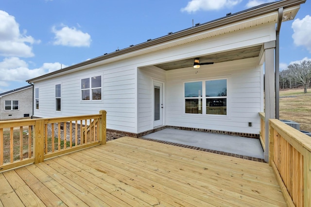 wooden deck featuring a ceiling fan