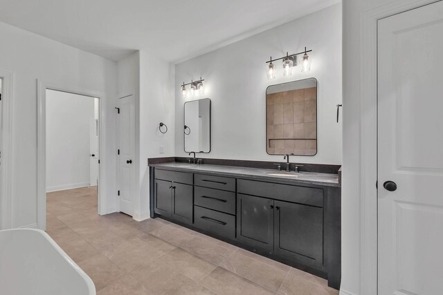 bathroom with vanity and a bath