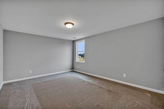 spare room featuring carpet flooring