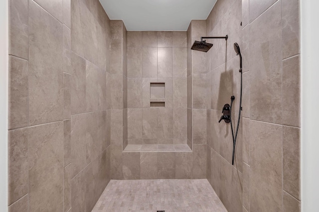 bathroom with a tile shower