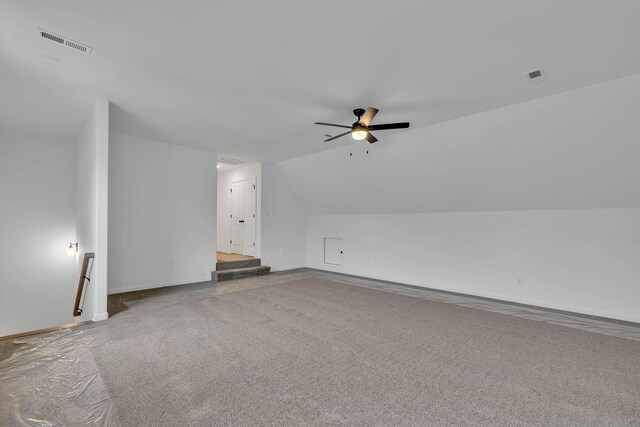 additional living space with carpet floors, vaulted ceiling, and ceiling fan